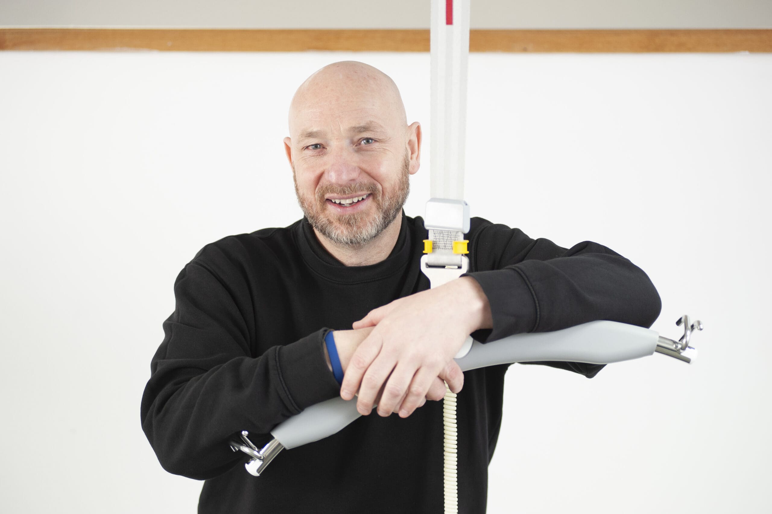 Kevin Sanders with a Ceiling Hoist ready for training – Multicare Medical